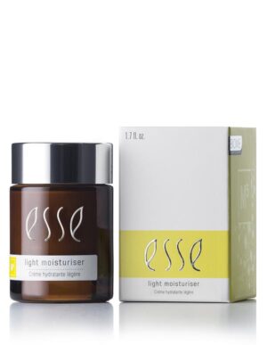 A 1.7 fl. oz. jar of Esse Light Moisturiser is showcased beside its matching white and yellow packaging. The jar features a dark amber hue, a black cap, and the product name "Esse Light Moisturiser" is prominently displayed in white text on both the jar and the box.