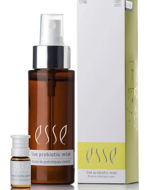 A brown spray bottle labeled "Live Probiotic Mist" stands beside a small vial and a white-and-yellow box, all featuring the Esse logo and matching product details.
